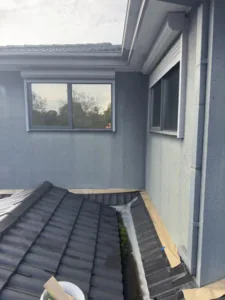 Roof and wall junction flashing beneath the rendered walls, Endeavour Hills home