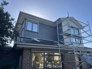 Two-tone grey and cream render finish on the upper storey, Endeavour Hills