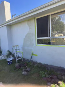 Front wall of a Keysborough home showing a patched section during preparation for exterior rendering.